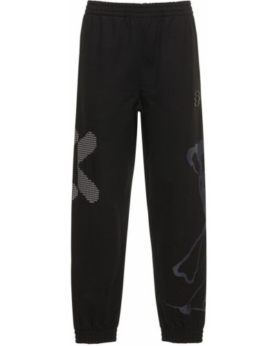 Памучни спортни панталони от джърси Mcq черно