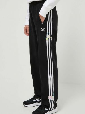 Černé sportovní kalhoty s aplikacemi Adidas Originals