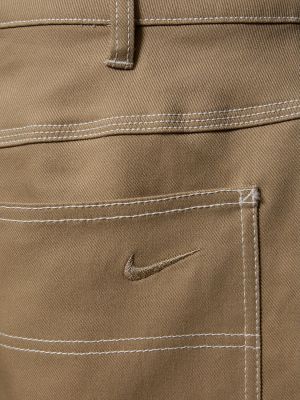 Bavlněné džíny Nike khaki