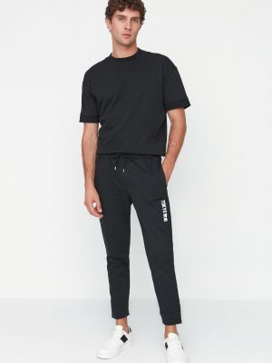 Sportovní kalhoty s potiskem Trendyol černé