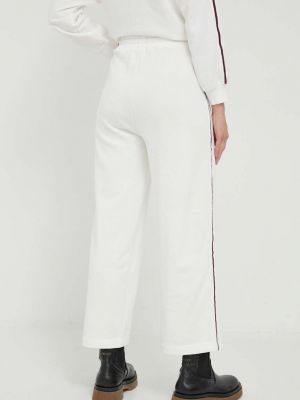 Bavlněné sportovní kalhoty s aplikacemi Pepe Jeans bílé