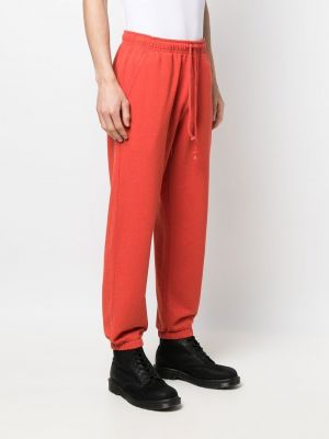 Sportovní kalhoty s výšivkou Paccbet červené