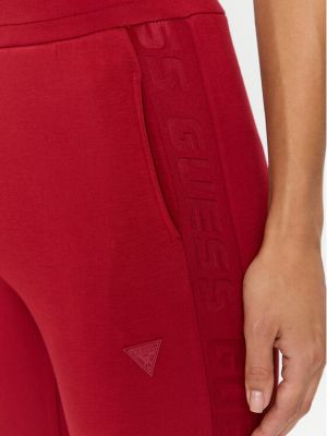 Priliehavé teplákové nohavice Guess červená