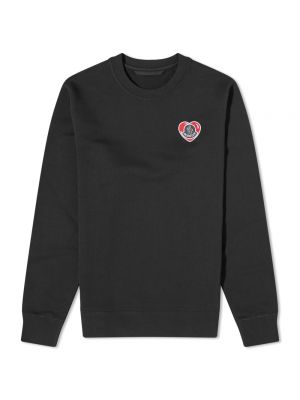 Черный свитер с сердечками Moncler