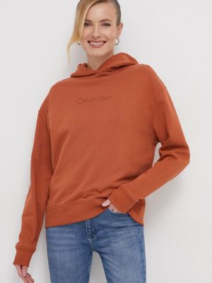 Pulover s kapuco Calvin Klein oranžna