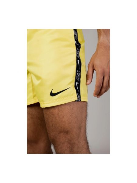 Traje con bolsillos Nike amarillo