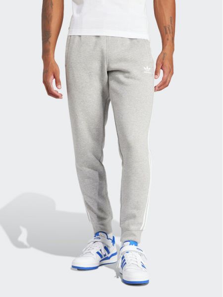 Pruhované slim fit priliehavé teplákové nohavice Adidas sivá