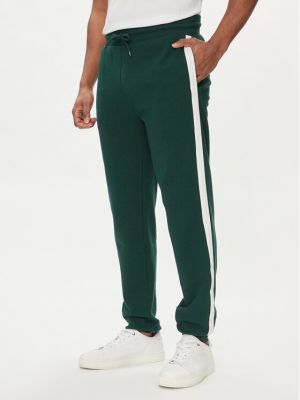 Priliehavé teplákové nohavice Tommy Hilfiger zelená