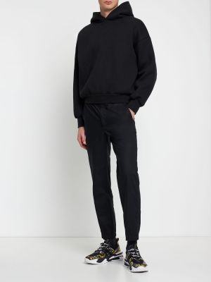 Bavlnené teplákové nohavice Versace Jeans Couture čierna