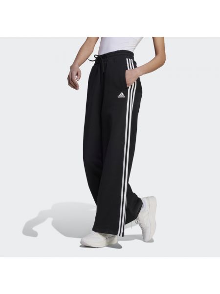 Spodnie sportowe w paski relaxed fit Adidas