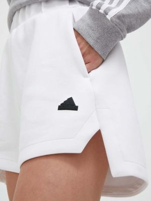 Белые однотонные шорты Adidas