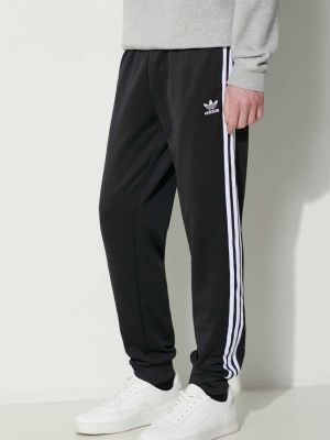 Czarne spodnie sportowe w paski Adidas Originals