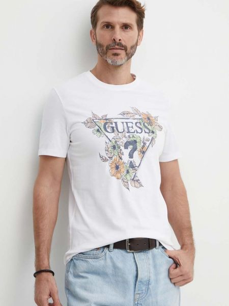 Koszulka bawełniana w kwiatki z nadrukiem Guess biała