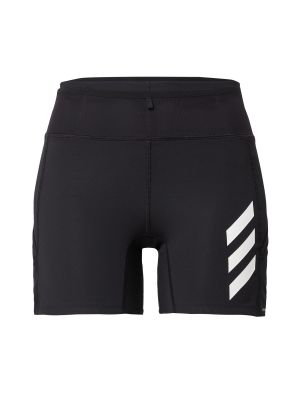 Jednofarebné teplákové nohavice na zips skinny fit Adidas Terrex