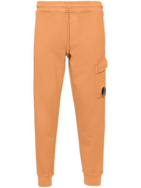 Bavlnené teplákové nohavice C.p. Company oranžová
