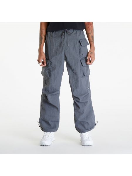 Pletené kalhoty se síťovinou Nike šedé