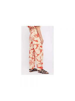 Pantalones slim fit de flores con estampado Laurence Bras naranja