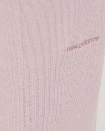 Pantaloni sport din bumbac New Balance roz