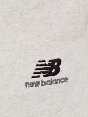 Pantaloni sport din bumbac New Balance gri