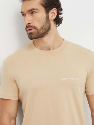 Koszulka bawełniana z nadrukiem Calvin Klein Jeans beżowa