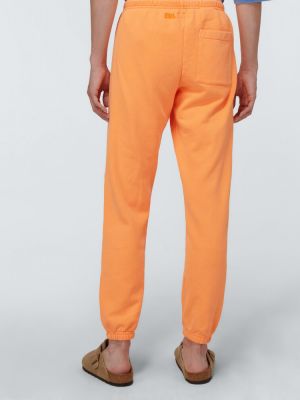 Bavlnené teplákové nohavice Erl oranžová