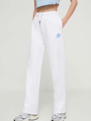 Sportovní kalhoty s aplikacemi Juicy Couture bílé