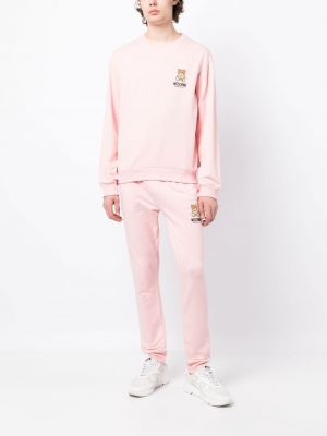Sportovní kalhoty s potiskem Moschino růžové