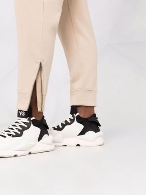 Běžecké kalhoty na zip Calvin Klein béžové