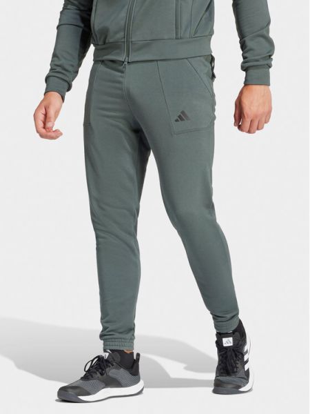 Priliehavé teplákové nohavice Adidas zelená