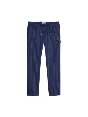 Spodnie slim fit w paski Tommy Jeans niebieskie