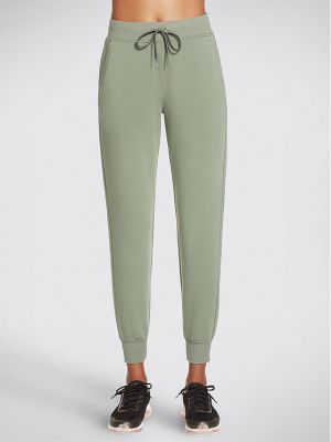 Priliehavé teplákové nohavice Skechers zelená