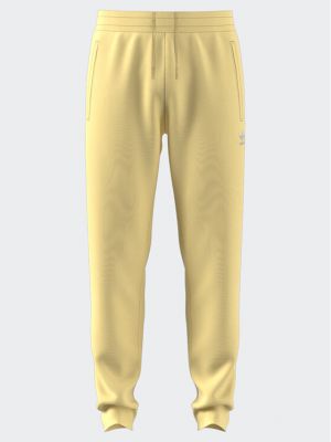 Спортни панталони slim Adidas жълто