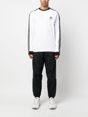 Bavlněné pruhované sportovní kalhoty s potiskem Adidas