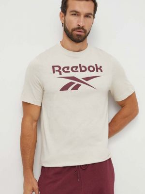 Bavlněné tričko s potiskem Reebok béžové
