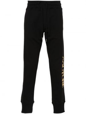 Kokvilnas treniņtērpa bikses ar apdruku Versace Jeans Couture