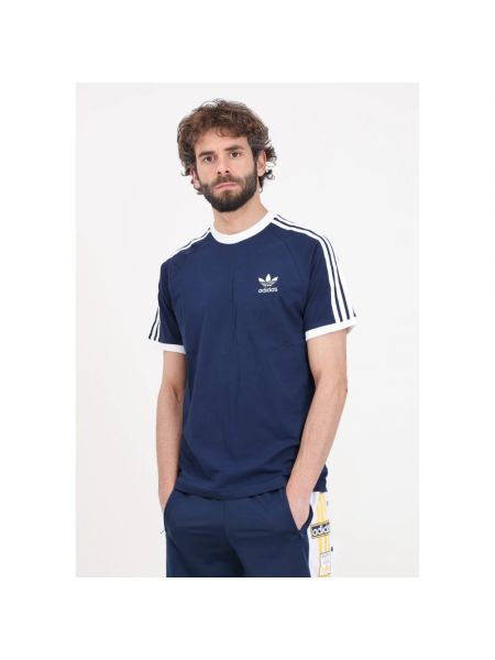 Koszulka bawełniana w paski Adidas Originals niebieska