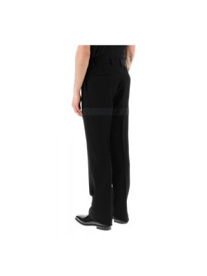 Pantalones chinos plisados Salvatore Ferragamo negro
