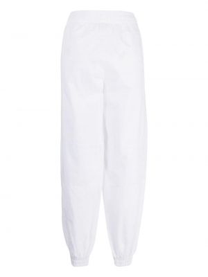 Bavlněné sportovní kalhoty Lacoste bílé