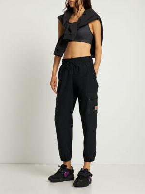Pletené cargo kalhoty z nylonu Nike černé