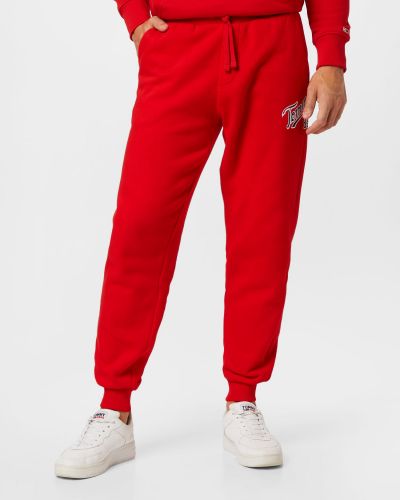 Teplákové nohavice Tommy Jeans červená