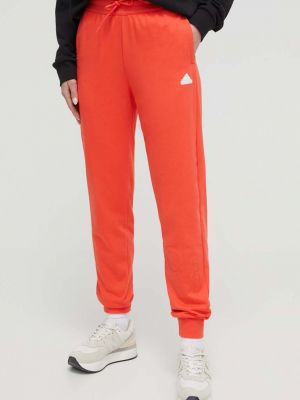 Spodnie sportowe z nadrukiem Adidas czerwone