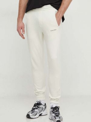 Spodnie sportowe Calvin Klein beżowe