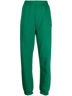 Teplákové nohavice Lacoste zelená