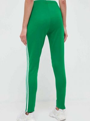 Sportovní kalhoty s aplikacemi Adidas Originals zelené