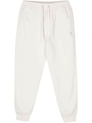 Teplákové nohavice s výšivkou Moose Knuckles biela
