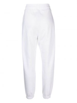 Spodnie sportowe z nadrukiem Tommy Jeans białe