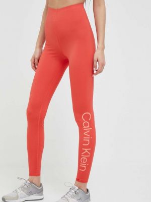 Spodnie sportowe z nadrukiem Calvin Klein Performance pomarańczowe