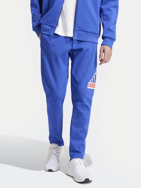 Priliehavé teplákové nohavice Adidas modrá