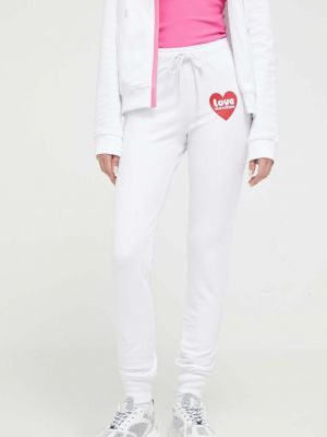 Białe spodnie sportowe z nadrukiem Love Moschino