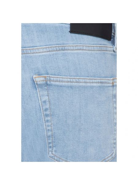 Jeansy skinny na guziki Calvin Klein niebieskie